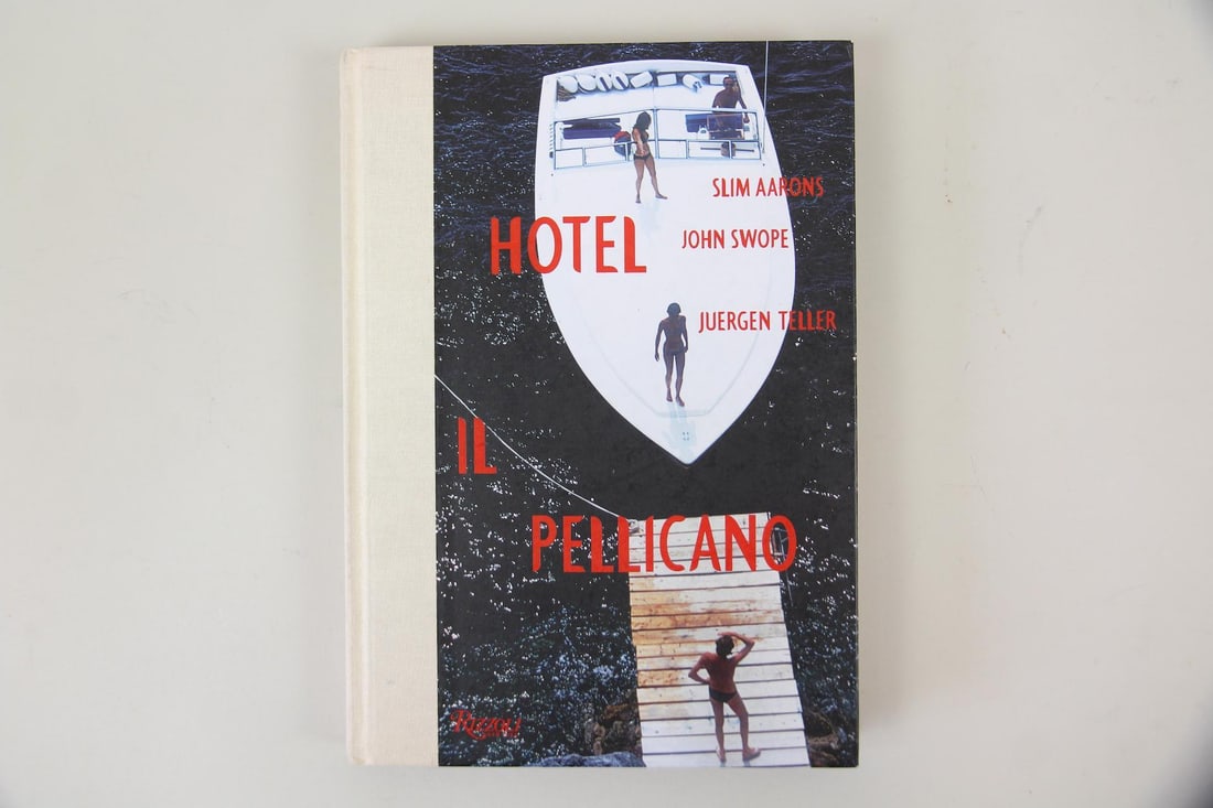 Hotel Il Pelicano Photo Book: Hotel Il Pelicano Photo Book. Rizzoli hardcover book titled Hotel Il Pellicano featuring photography by Slim Aarons, John Swope, and Juergen Teller, representing three different eras of the storied It