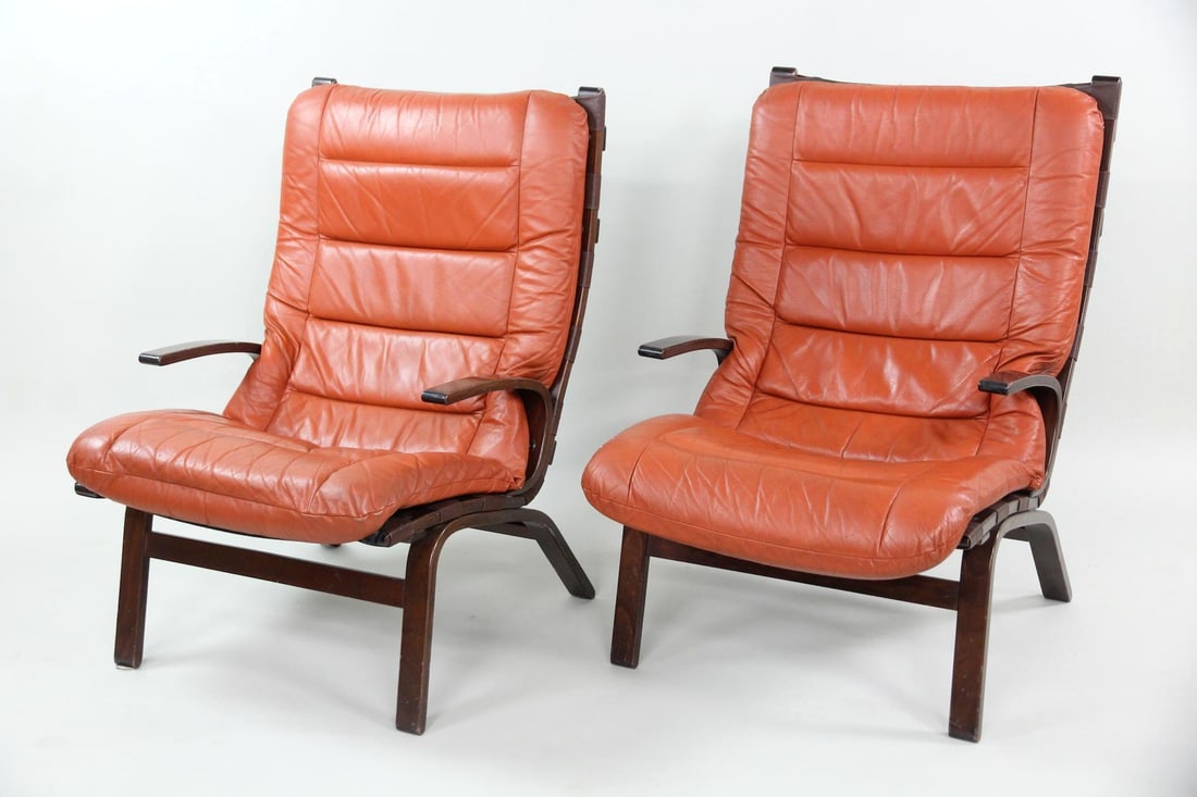 Farstrup Møbler "Miljo" Lounge Chairs, Orange Leather: Pair of Danish Mid-century Modern Farstrup Møbler "Miljo" Lounge Chairs, Orange Leather. These chairs have deep-toned bentwood frames with integrated armrests. The segmented cushions are orange rust 