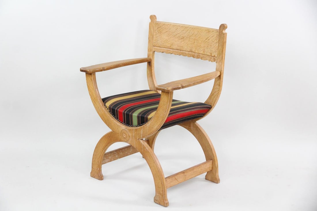 Oak Kurul Chair, Henning Kjærnulf for EG Kvalitetsmøbel: Danish Mid-century Modern Oak Kurul Chair, Henning Kjærnulffor EG Kvalitetsmøbel. This is a modern kurul chair made of oak with carved details. Its upholstered seat features wool fabric with green,