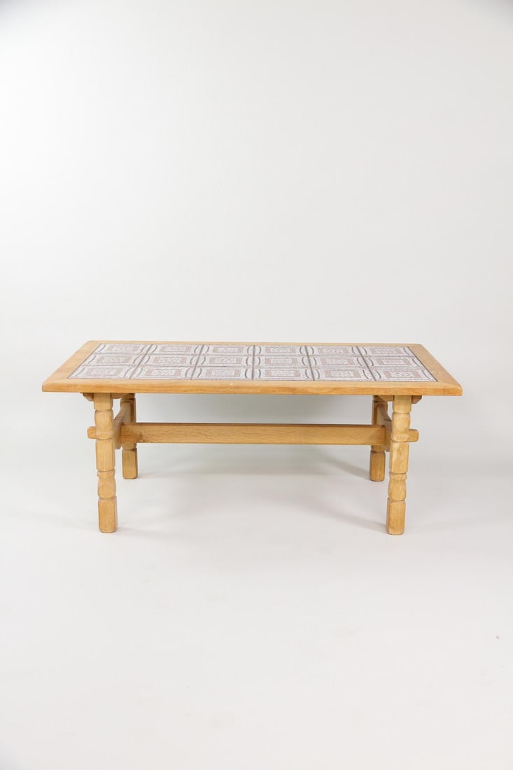 Rustic Oak Tile Top Coffee Table, Henning Kjaernulf: Brutalist Danish Oak Tile Top Coffee Table, Henning Kjaernulf. Coffee table featuring a carved oak frame and gray & purple tiled top. Dimensions are 22 in h x 54 in w x 30 in d. Condition is good
