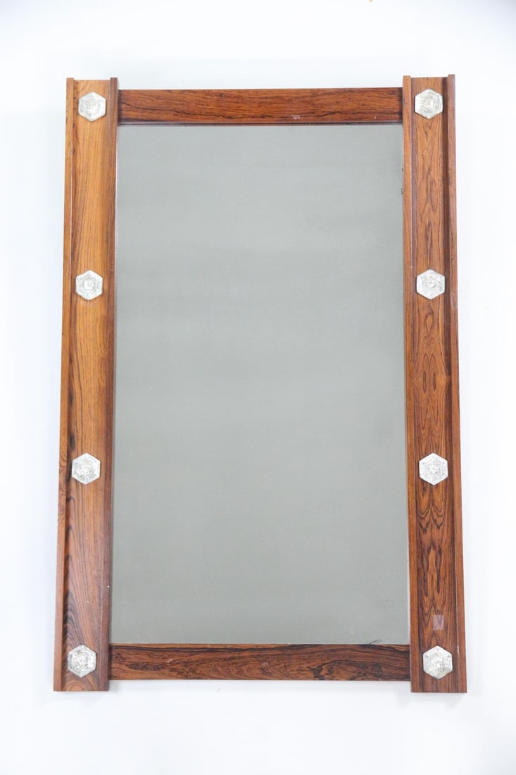 Scandinavian Rosewood Mirror with Glass Studs: Danish Mid-Century Modern Scandinavian Rosewood Mirror with Glass Studs. Wall mirror with rosewood frame, detailed with hexagonal glass studs. Dimensions are 47 in h x 30 in w x 1.25 in d. Condition i