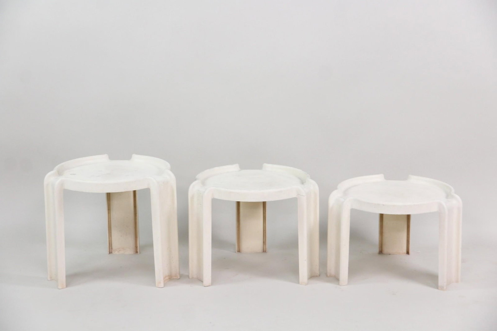 Giotto Stoppino for Kartell Plastic Stacking Tables: Postmodern Giotto Stoppino for Kartell Plastic Stacking Side Tables. Set of three-legged side tables that snugly nest together. Made of molded white plastic. Embossed to the underside, Giotto