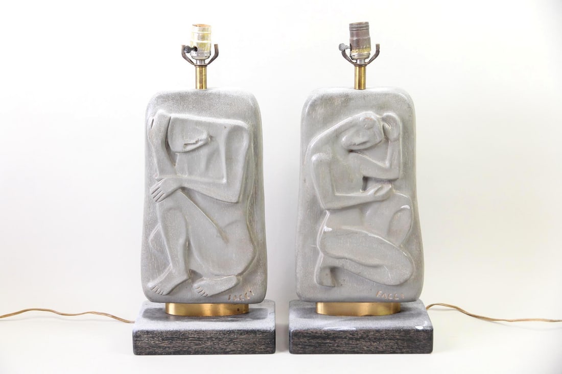 Pair of Modernist Figure Table Lamps by Domenico Facci: Pair of Modernist Carved Figure Table Lamps by Domenico Facci. A sculptural pair of table lamps made out of carved wood with a gray finish, each one depicting a crouched figure. Signed "Facci" to the