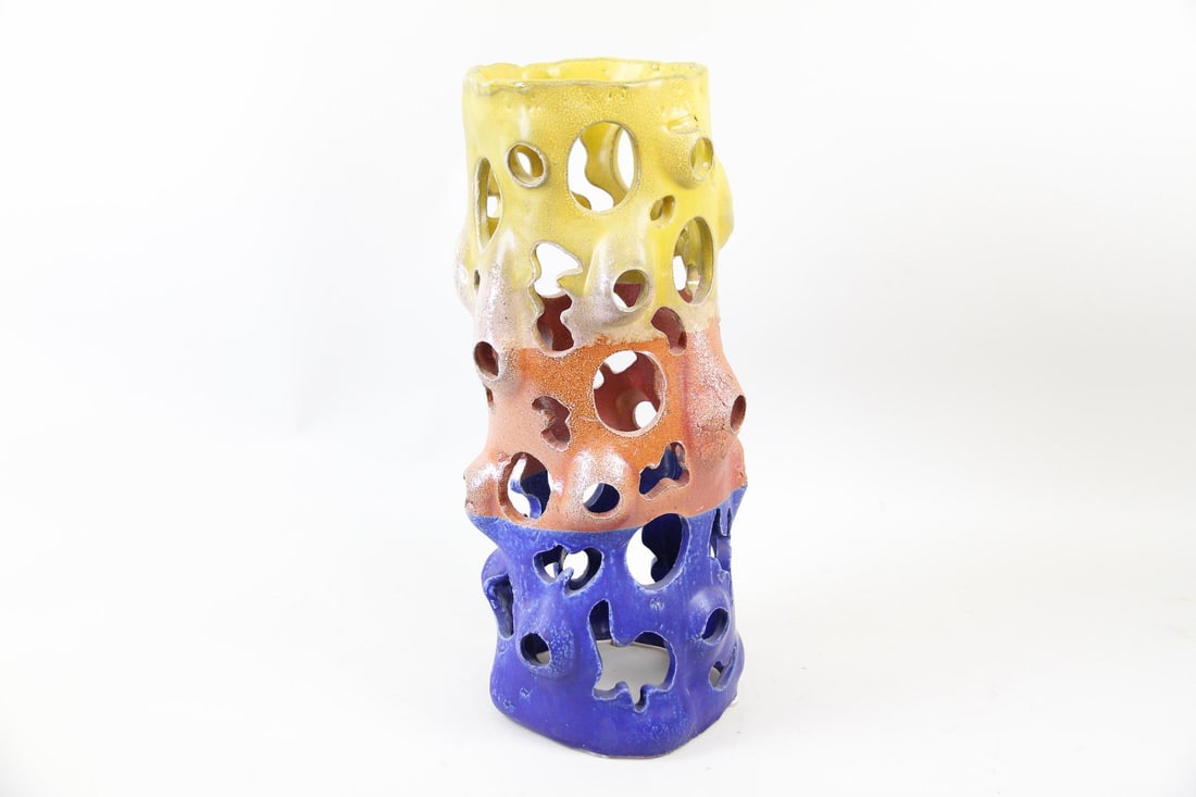Arnie Zimmerman Stoneware Sculpture, Yellow, Orange, Blue Vase: Arnie (Arnold) Zimmerman Abstract Stoneware Sculpture, Untitled, Yellow, Orange, Blue Vase. An organic cylindrical vessel with small cutout forms. Made of soda fired stoneware in three distinct colore