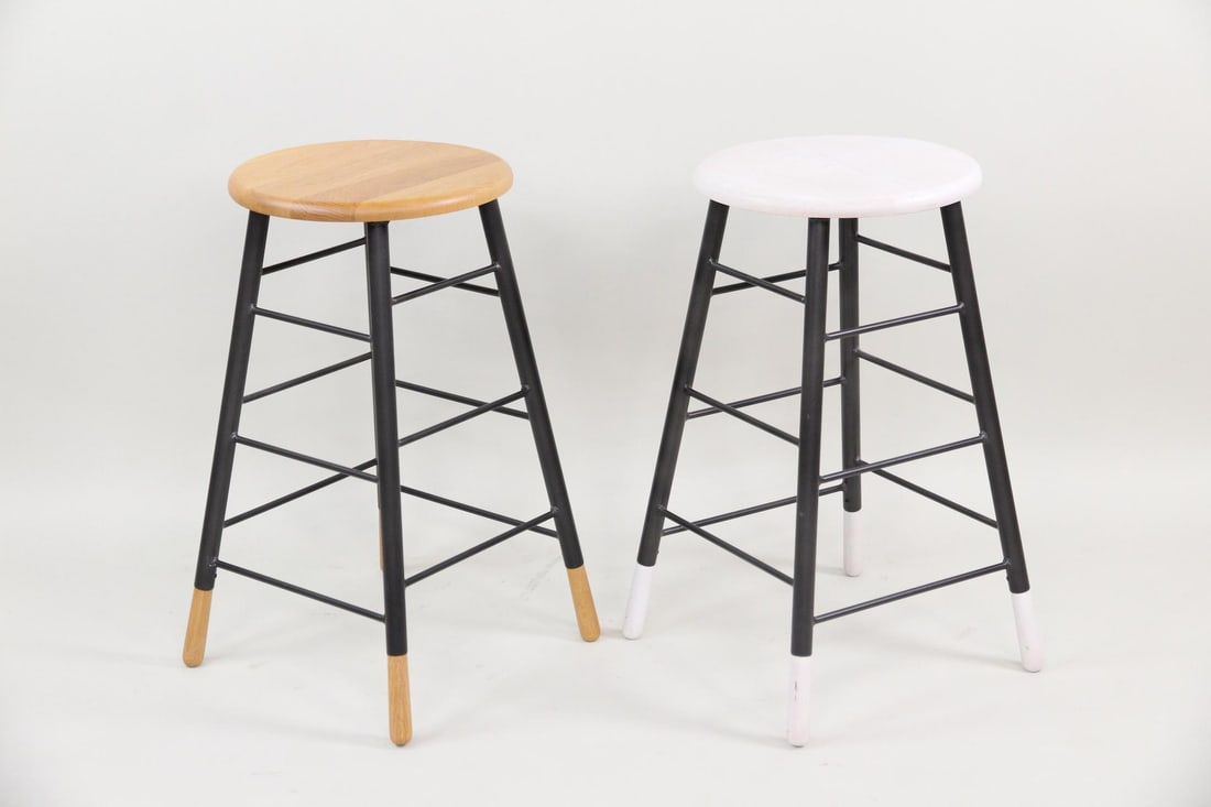 Pair of Lostine "Gordon" Stools: Pair of Lostine "Gordon" Stools. Two contemporary counter height stools, designed with a industrial metal base and a solid wood seat. Both have black bases, with one white seat and one natural wood. M