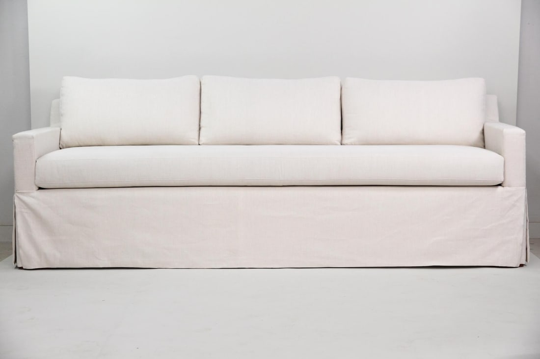 Minimalist 3 Seat Sofa in Cream Linen: Minimalist Custom 3 Seat Sofa in Cream Linen. 3 cushion sofa with 3 back cushions and bench seat. Dimensions are 32.5 in h x 97 in w x 33.5 in d. Condition is good with a few very minor stains. Some