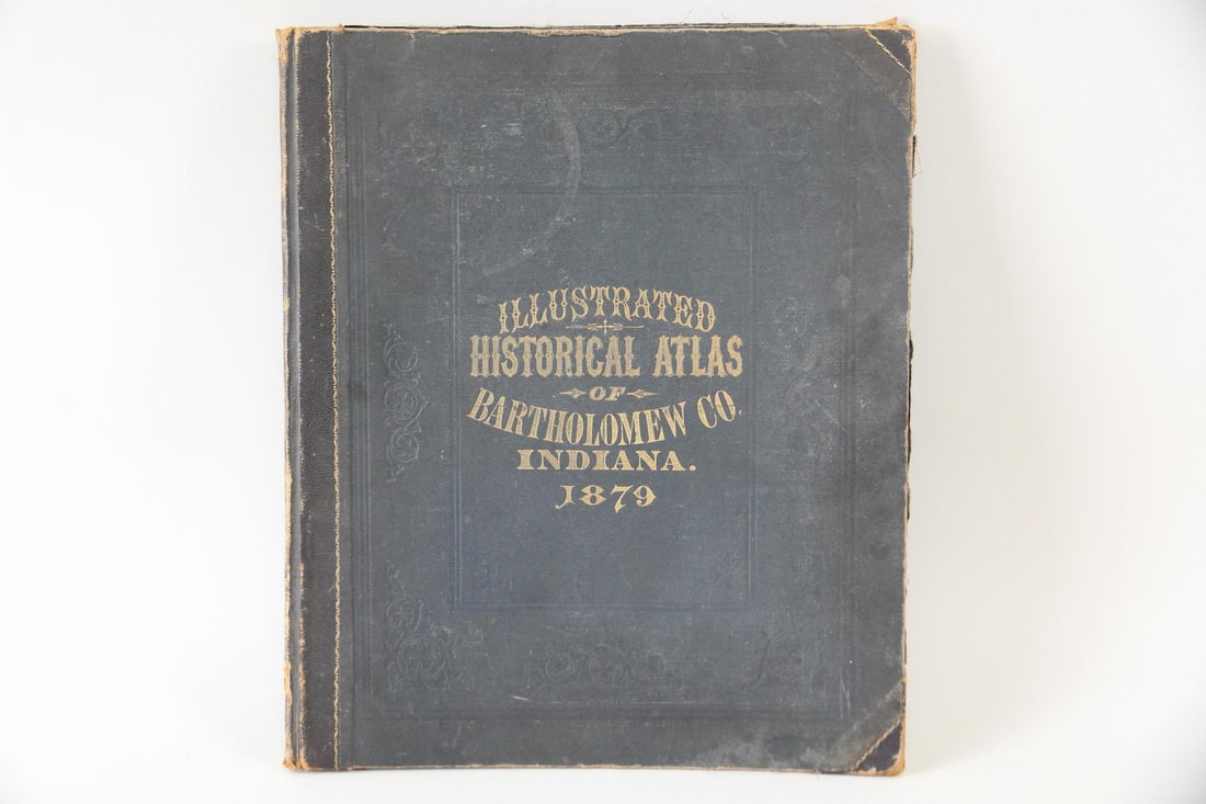 1879 Illustrated Atlas of Bartholomew Co., Indiana: 1879 Illustrated Atlas of Bartholomew Co., Indiana. An illustrated atlas with leather cover. Published by J.H Beers & Co., 1879. Dimensions are 17.5 in h x 14.5 in w x 1 in d. Condition is as is.