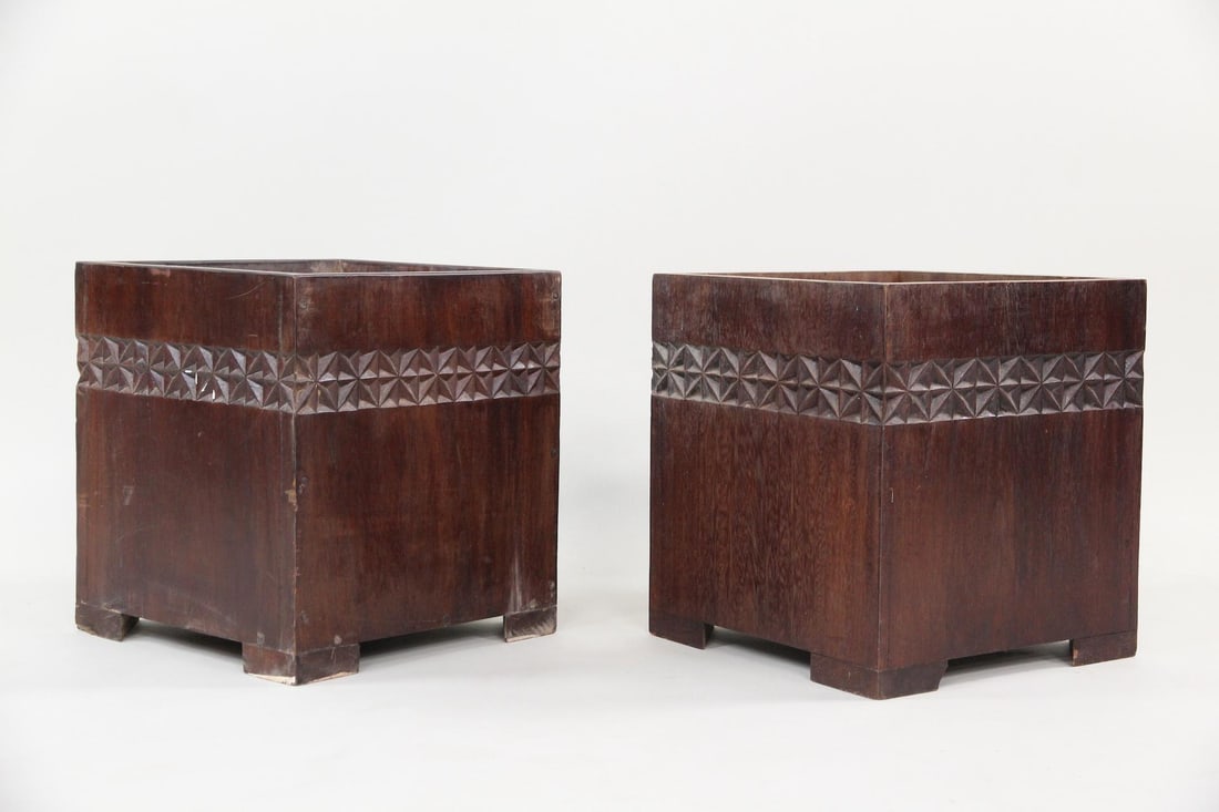 Pair of Solid Mahogany Carved Minimalist Planters, Smaller: Pair of Solid Mahogany Cubist Carved Minimalist Planters. These are solid wood planters made from Mahogany. They have dirt interiors from being used. Great minimalist geometric carving around the bord