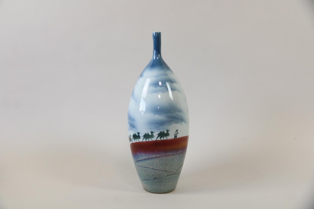Tall Chinese Porcelain Jingdezhen Vase, Camel Motif: Round Chinese Porcelain Jingdezhen Vase, Camel Motif. This vessel has a tall body and elongated neck, with horizontal glazes evoking a landscape with a man & camels. Inscribed "Jingdezhen" to the bott