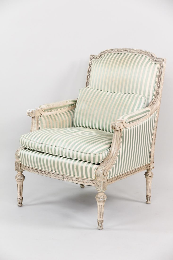 EJ Victor Louis XVI Armchair, Satin Striped Upholstery: EJ Victor Contemporary Louis XVI Bergere, Satin Striped Upholstery. This elegant armchair has a carved wooden frame with white paint and pale green satin striped upholstery. Labeled EJ Victor.