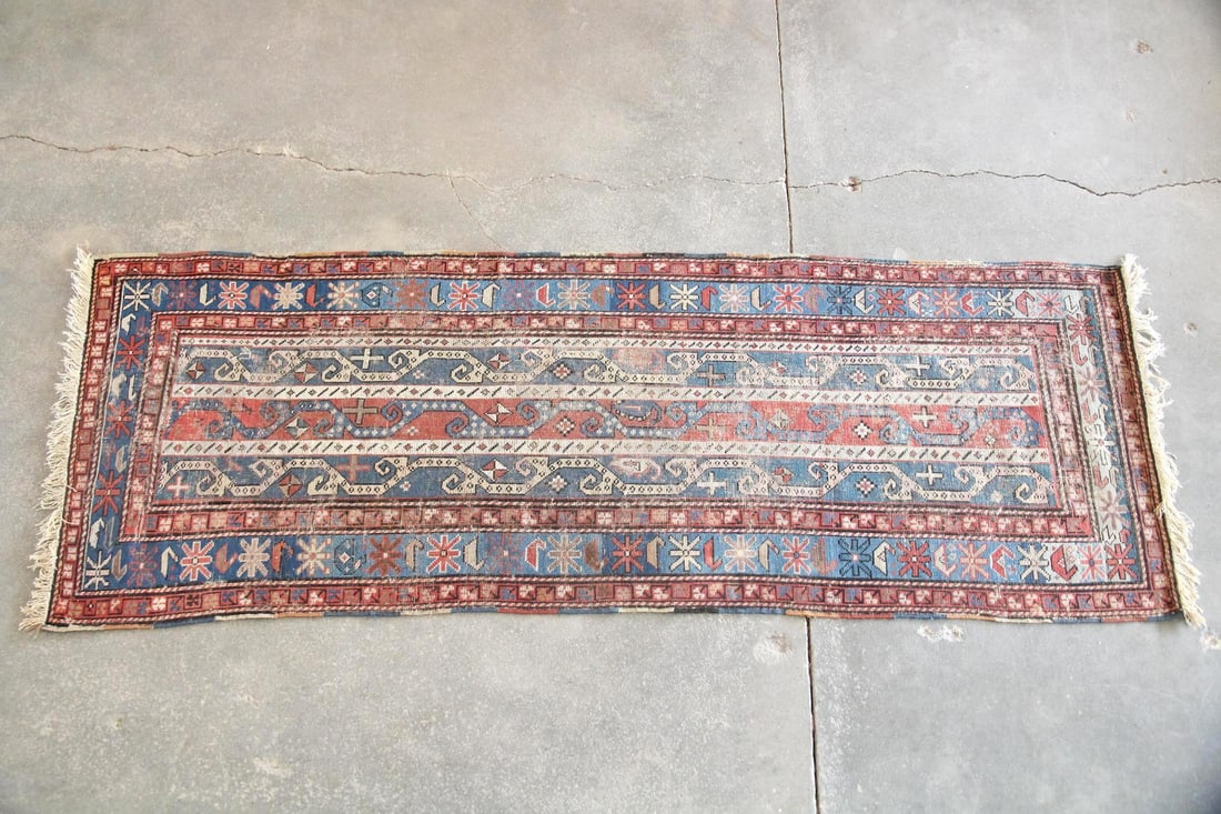Caucasian Geometric Wool Runner Rug, 8.5 Ft: Caucasian Geometric Wool Runner Rug. A nomadic handwoven runner featuring a long, geometric design with central blue, beige, & soft red bands. It is adorned with traditional tribal motifs. Made of