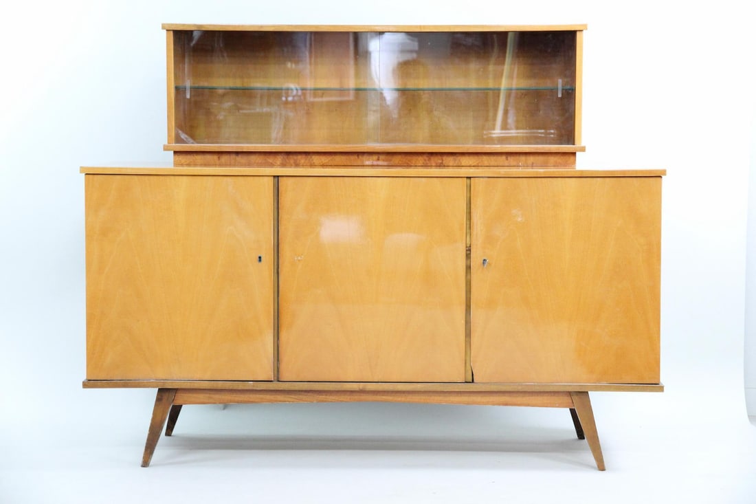 Mid-Century Modern Polish Credenza, Zjednoczenie Przemysłu Meblarskiego: 2 Tier Mid-Century Modern Lacquered Credenza from Lodz, Sideboard. Unusual credenza with glass front cabinet above a 3 door cabinet. With a Polish label dating the piece to 1968. Key included. Possibl