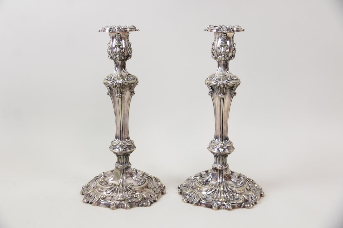 Pair of Heavy Silver Rococo Candlesticks, 1 of 2: Pair of Heavy Silver Rococo Candlesticks, 1 of 2. Matching pair of heavy and ornate candlesticks. Unmarked. Dimensions are 12.75 in h x 6.5 in w x 6.5 in d. Condition is good with some minor tarnish