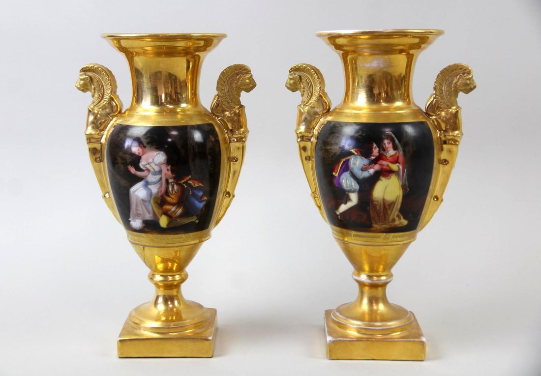 Pair of Old Paris Gilt Porcelain Vases, Romantic Scenes: Pair of Empire Old Paris Gilt Porcelain Vases, Romantic Scenes. These vases feature intricate hand-painted scenes depicting romantic couples in period attire. They have gilded accents and ornate lion 