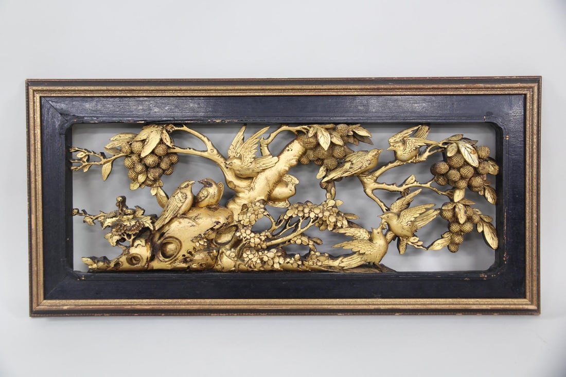 Chinese Carved Giltwood Wall Panel with Birds: Antique Chinese Carved Giltwood Wall Panel with Birds. Decorative wall panel with intricate, 3D relief carvings of birds and floral motifs and finished with gold. Dimensions are 42 in h x 19.5 in w x