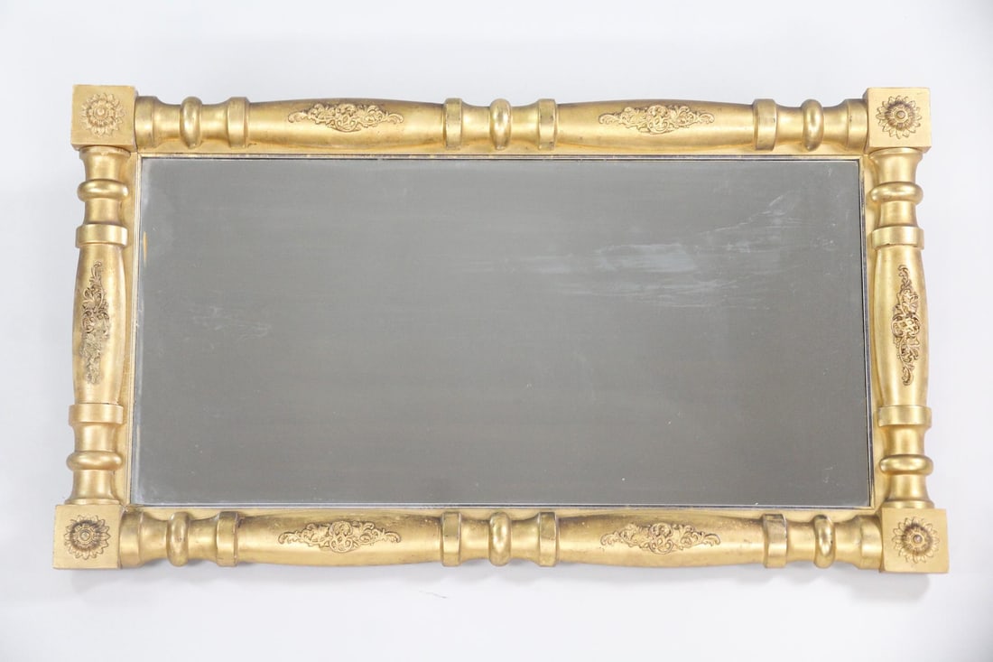 Federal Gold Gilt Mirror, Giltwood, Horizontal: 19th C. Federal Neoclassical Giltwood Mirror. Mirror in a neoclassical giltwood frame, with split baluster sides and floral details. Dimensions are 24 in h x 42.5 in w x 3 in d. Condition is good