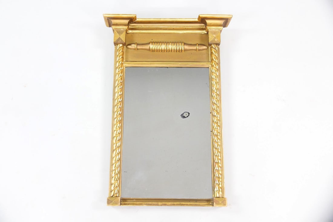 Federal Gold Gilt Tabernacle Mirror: Federal Gold Gilt Tabernacle Mirror. Classical mirror featuring a carved giltwood frame with twisted column borders and an upper decorative panel. Dimensions are 25.25 in h x 17.75 in w x 3.5 in d.