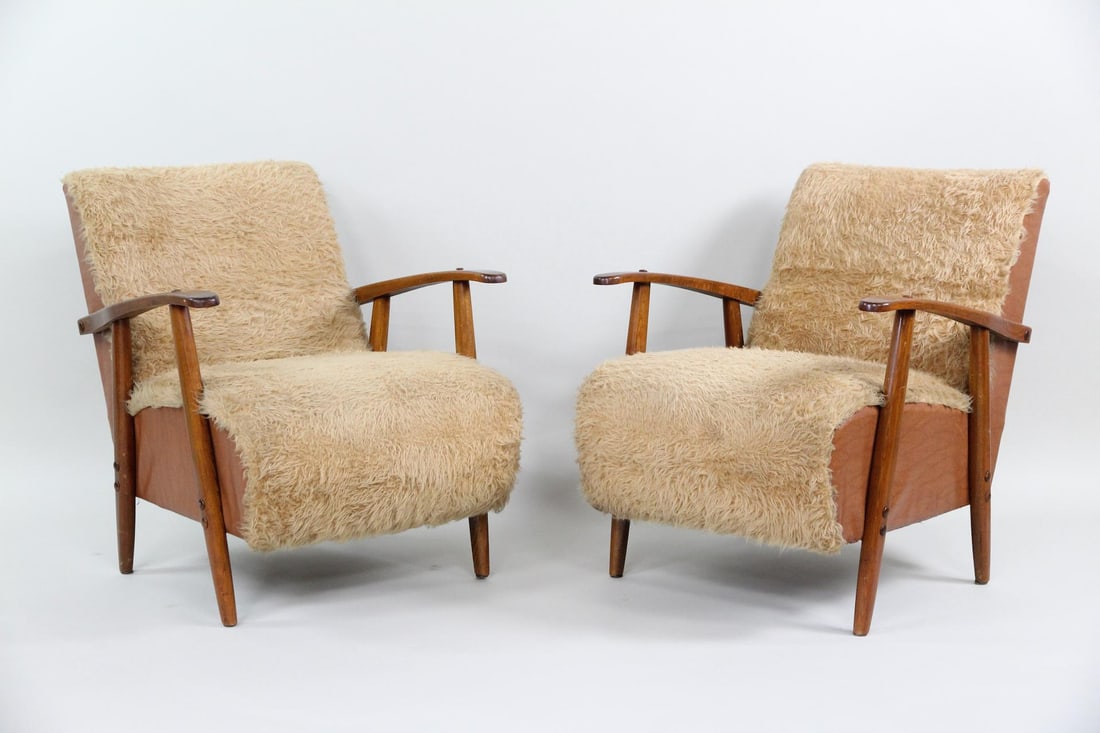 Pair of Scandinavian Modern Faux Shearling Club Chairs: Pair of Scandinavian Mid-Century Modern Shearling Lounge Easy Chairs. Matching pair of lounge chairs with brown vinyl sides, wooden frames and faux (we believe) shearling seats and backs. Dimensions