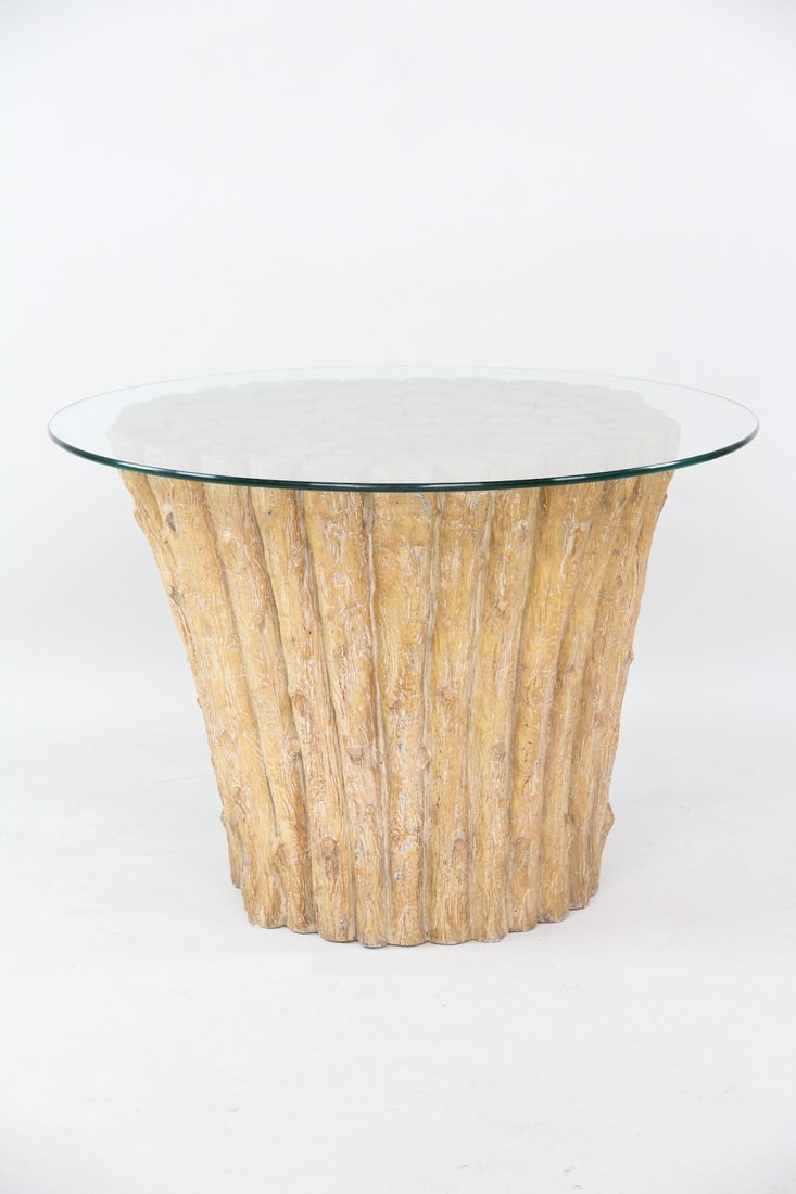 Faux Bois Fiberglass Table: Mid-Century Modern Faux Bois Fiberglass Table with Glass Top. Resembling a bundle of stocks, base is made of fiberglass and wood, with a round glass top. Dimensions are 29.75 in h x 42 in w x 42 in d.