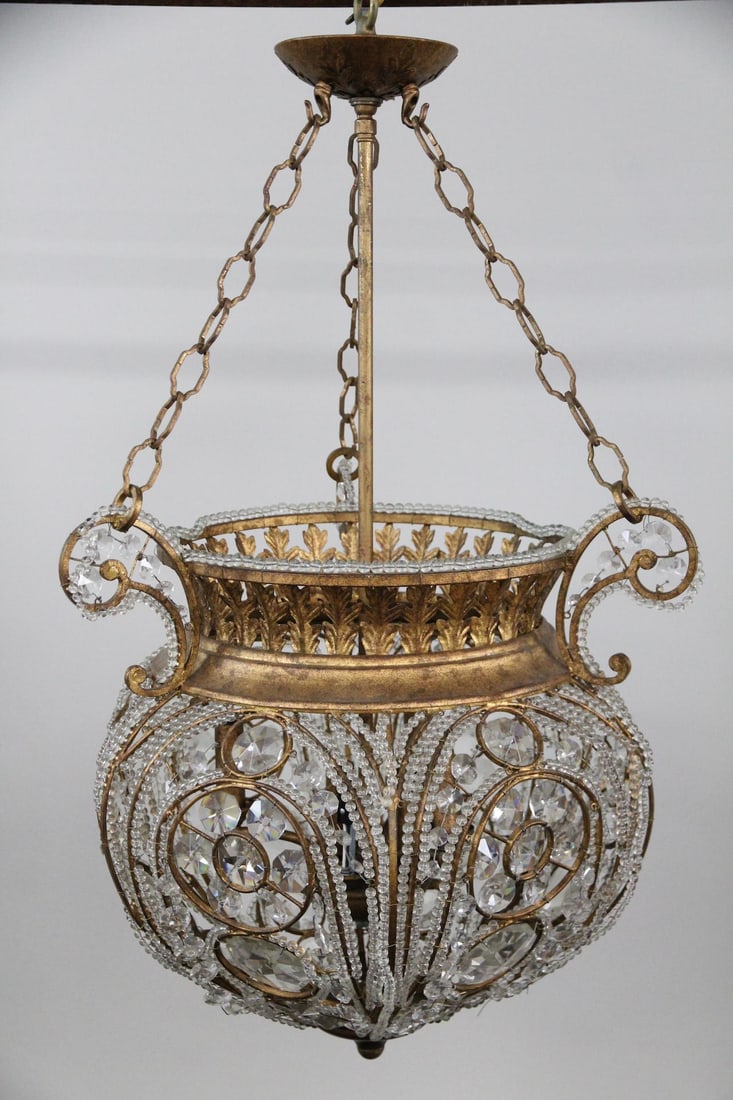 Italian Bohemian Crystal and Gilt Metal Basket Chandelier: Italian Bohemian Crystal and Gilt Metal Basket Chandelier. It features a heavily adorned with crystals acorn basket shape of gilt brass. Dimensions are 36 in h x 20 in w x 20 in d. Condition is good. 