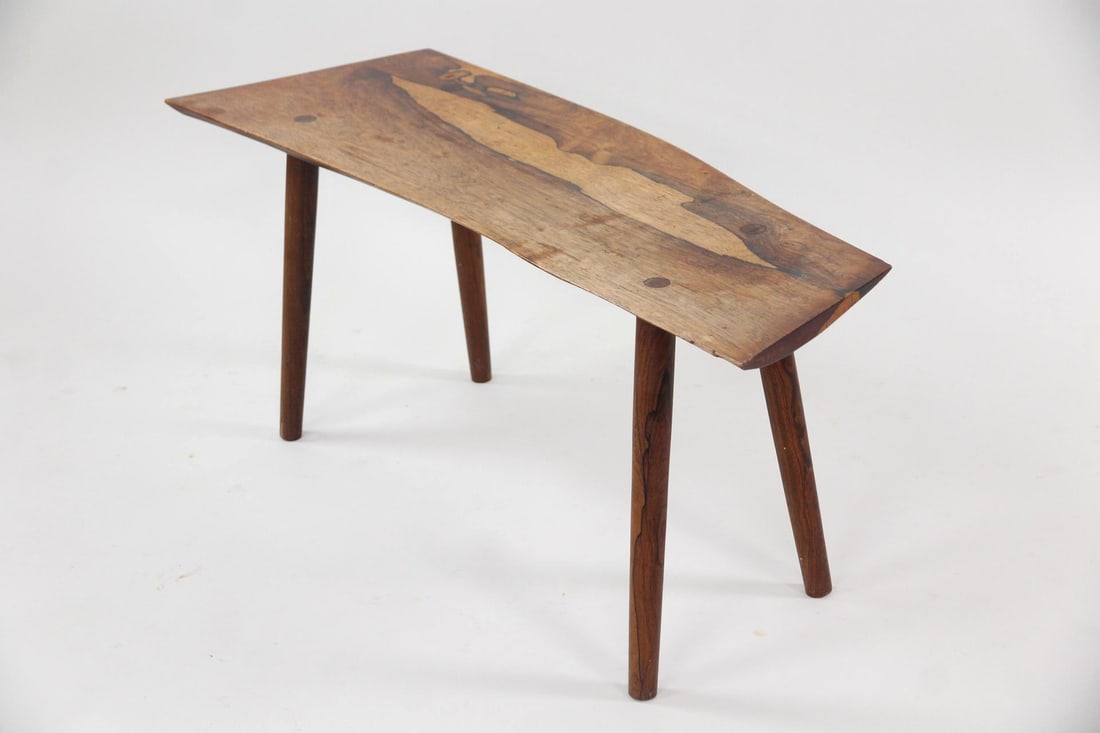 Rosewood Live Edge Coffee Table or Bench: Danish Mid-century Modern Rosewood Live Edge Coffee Table or Bench. This versatile live-edge table or bench is made of rosewood with a beautiful grain, and sits on four splayed legs. Dimensions are 17