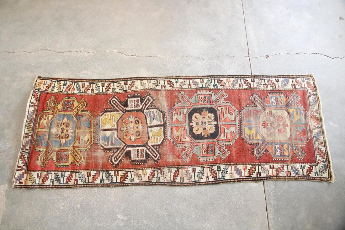 Caucasian Tribal Kazak Runner, 8.5 Ft: Caucasian Tribal Geometric Kazak Runner, 8.5 Ft. A wide runner with four large-scale medallions and strong geometry. Rust, cerulean, ivory, coral, and brown vegetable dyed wool on a wool ground. Soft 