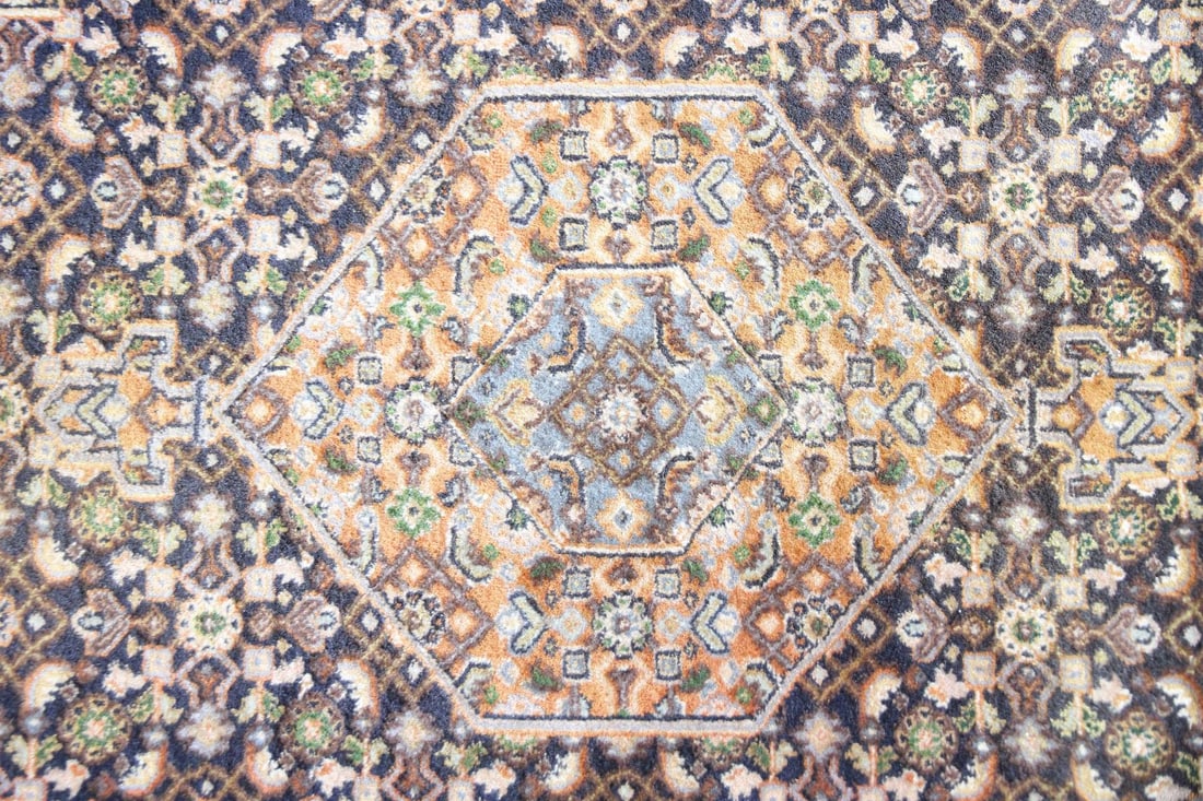 Persian Wool Rug with Hexagon Medallions: Persian Wool Rug with Hexagon Medallions. A Persian style, likely woven in Iran, featuring strong hexagonal medallions and small-scale floral and geometric patterning. Densely woven wool on cotton. Di