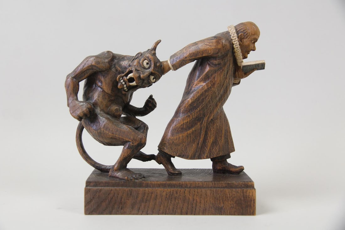 Gottfred Krause Folk Art Oak Sculpture, Priest Controlling the Devil: Gottfred Krause Folk Art Oak Sculpture, Priest Controlling the Devil. Well detailed sculpture carved from oak depicting a priest pulling the devil by its horn. Signed GK on the underside by the