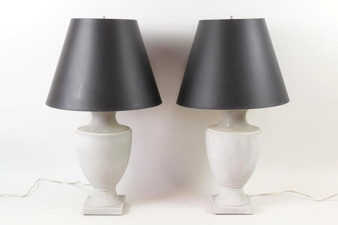Pair of Gray Plaster Urn Shaped Lamps: Pair of Neoclassical Gray Plaster Urn Shaped Lamps. These lamps have black shades. They have nice chrome hardware. Dimensions are 27.5 in h x 7.25 in w x 7.25 in d. The shades are 16 in dia.