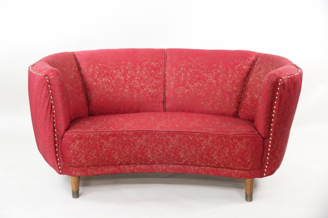 Red Channel-Back Banana Sofa: Danish Mid-Century Modern Red Channel-Back Banana Sofa. Nice sofa in red fabric with nailhead trim. Dimensions are 29 in h x 62 in w x 38 in d. Seat height is 16.5 in. Condition is good with minor wea