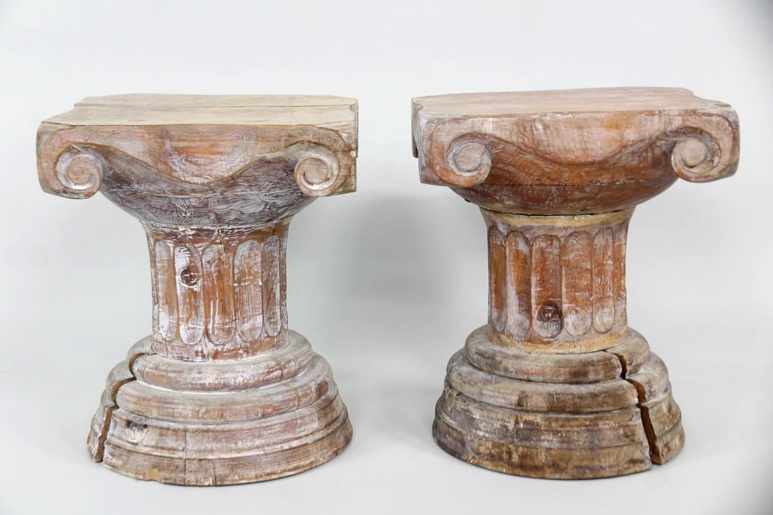 Pair of Neoclassical Wooden Column Side Tables: Pair of Neoclassical Wooden Column Side Tables. Pair of tables in the form of ionic columns. Made of carved wood with a textural surface and white painted wash. Dimensions are 16 in h x 13 in w x 13 i