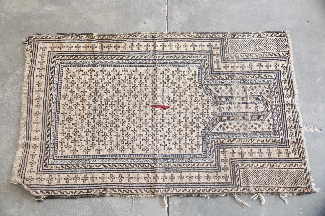Caucasian Tribal Wool Prayer Rug: Caucasian Tribal Wool Prayer Rug. Scatter rug with an all-over cross motif and directional niche. It can an unusual red shape woven in the center. Soft, hand knotted wool with a flexible handle. Dimen