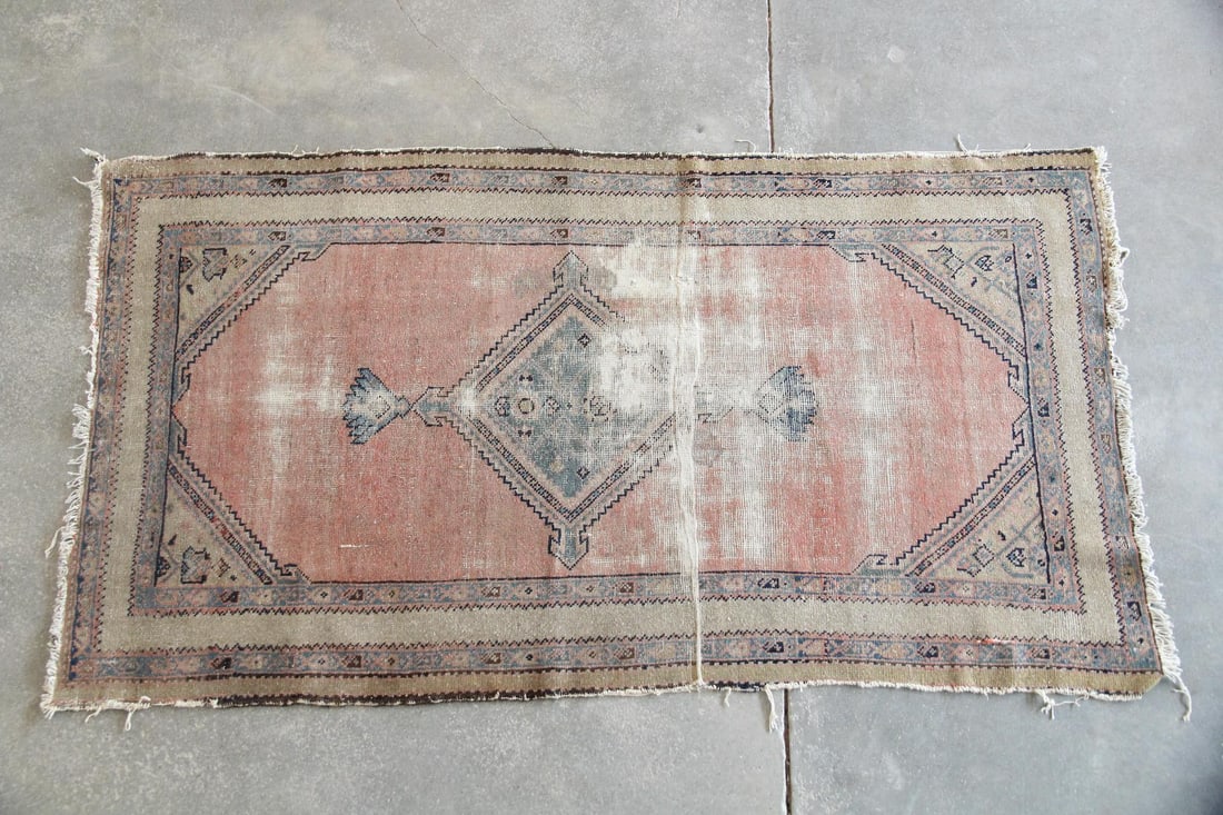 Turkish Oushak Wool Rug, Pink & Blue: Turkish Oushak Wool Rug, Pink & Blue. This handwoven rug features a salmon-pink field with a central diamond medallion and geometric borders in faded blue and beige tones. Wool on cotton. Dimensions a