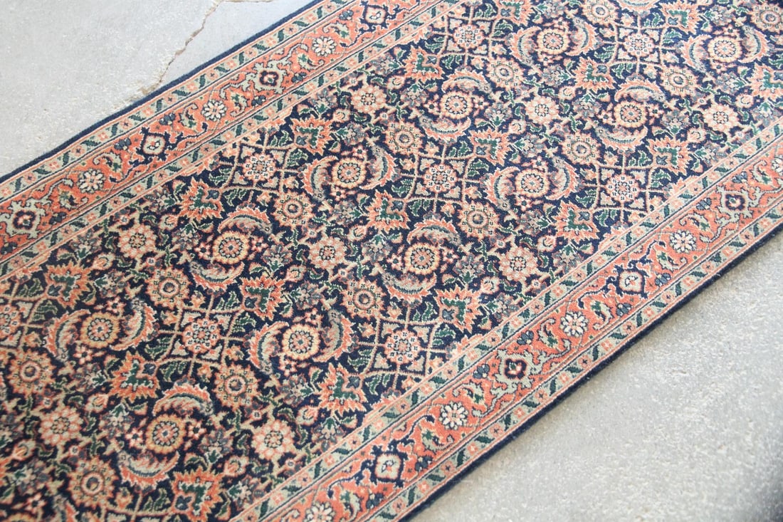 Persian Tabriz Runner, Wool & Cotton, 16 Ft: Botanical Persian Tabriz Runner Rug, Wool & Cotton, 16 Ft. A long, handwoven runner with repeating floral & geometric patterning in soft red, navy blue, tan, & green. Densely knotted wool on cotton gr