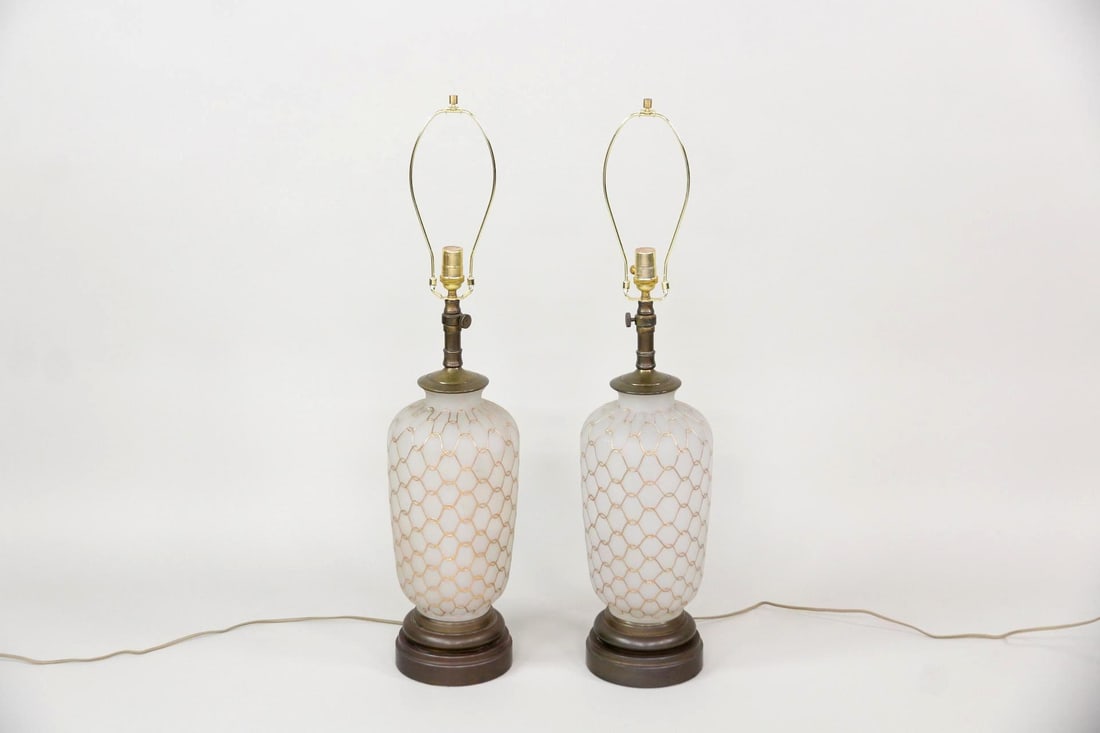Pair of Frosted Glass Table Lamps, Gold Lattice: Pair of Hollywood Regency Mid-century Frosted Glass Table Lamps. A pair of table lamps with frosted white glass bases covered in a gold lattice pattern and mounted on brass pedestals. Dimensions are 3
