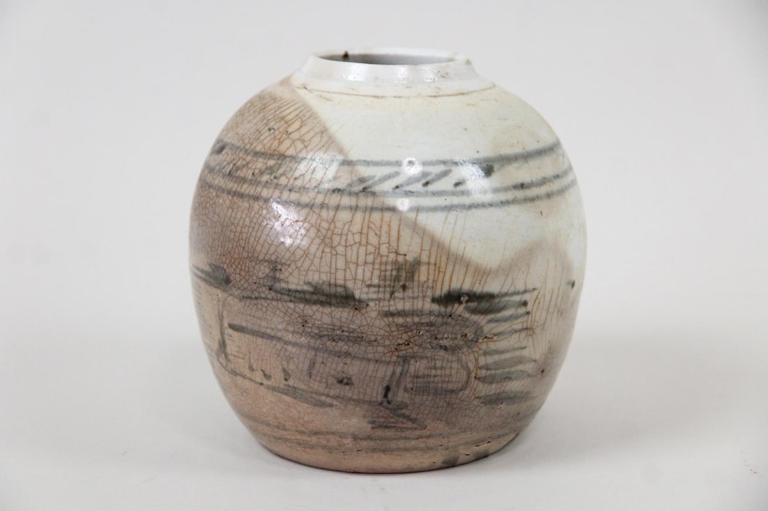 Antique Chinese Ginger Jar: Antique Chinese Ginger Jar Vase. Ceramic ginger jar with hand painted black decoration. Dimensions are 6.25 in h x 6.5 in w x 6.5 in d. Condition is good with crazing and discoloration. Please call