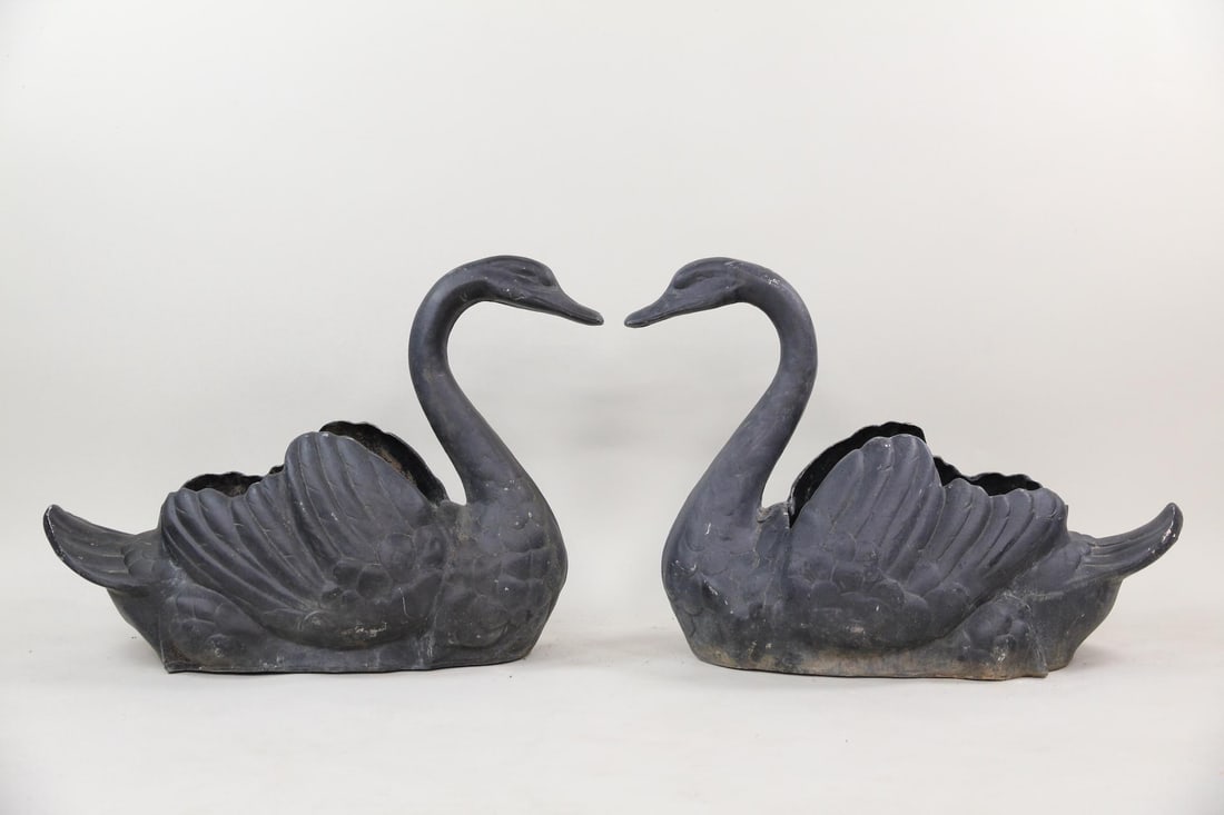 Pair of Lifesize Cast Aluminum Swan Planters: Pair of Lifesize Cast Aluminum Swan Planters. These are cast aluminum with older black paint on them. Could be stripped to raw silver aluminum color underneath. Nice details. Not too heavy being alumi