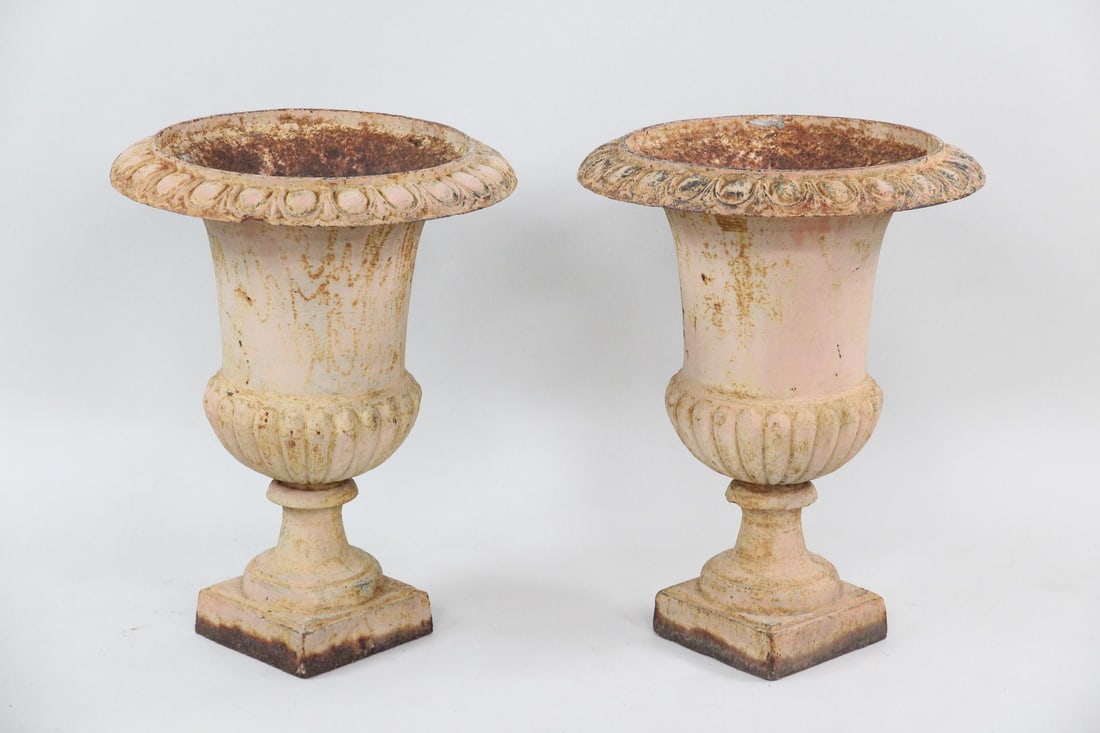 Pair of Off White Cast Iron Planter Urns: Pair of Off White Cast Iron Planter Urns. Nice matching pair of urns in a dirty of white paint. Nice larger scale. Dimensions are 25 in h x 19 in w x 8 in d. Condition is good, some paint loss. one sm