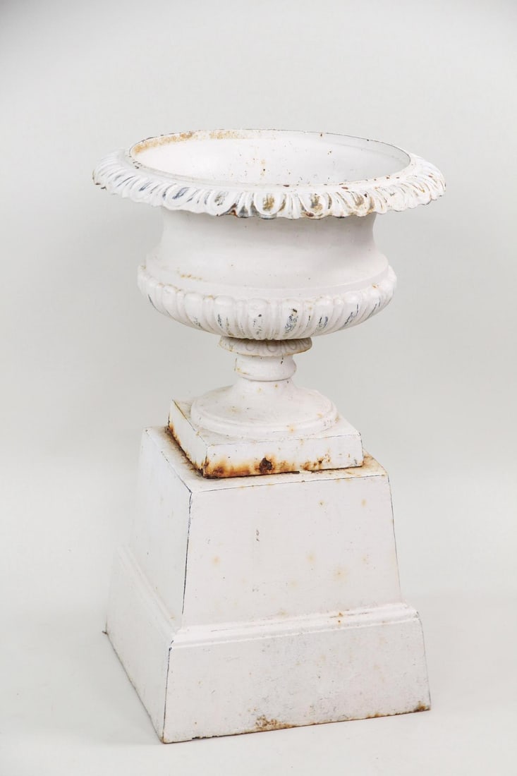 White Cast Iron Planter Urn on Pedestal: White Cast Iron Planter Urn on Pedestal. Nice sized urn in white paint on matching pedestal. Dimensions are 30.5 in h x 19.5 in w x 19.5 in d. Condition is good, some paint crazing. Please call or ema