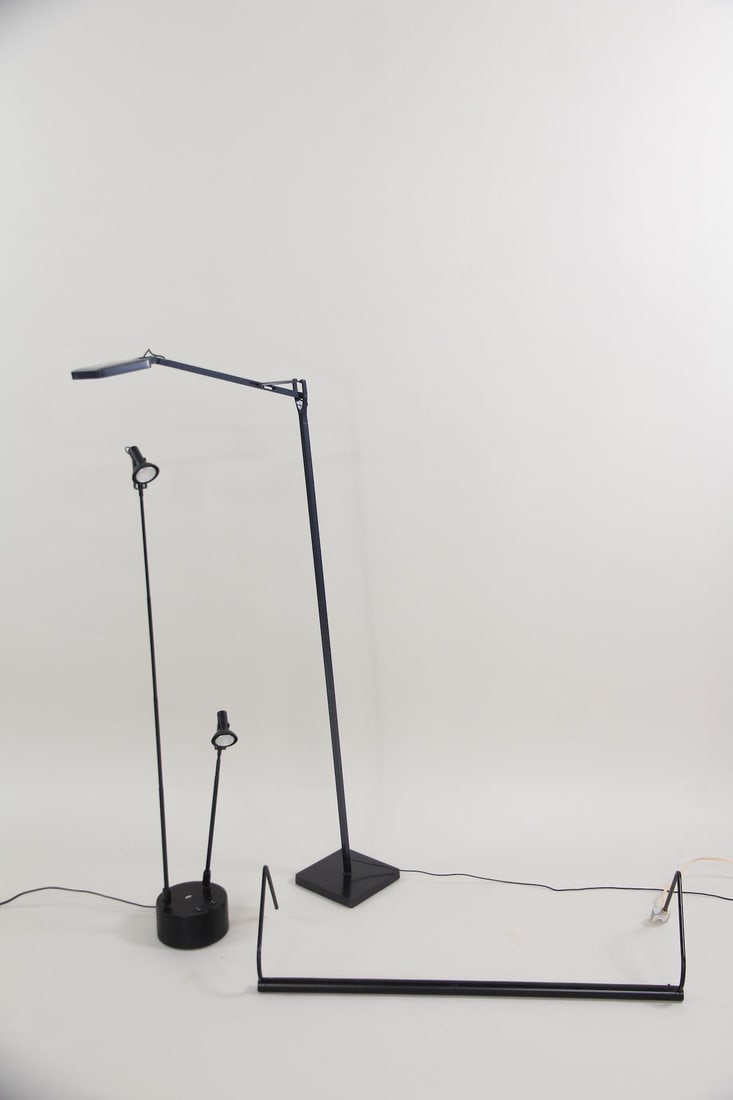 Lot of 3 Black Postmodern Lights: Lot of 3 Black Postmodern Lights, Lamps. Includes a wall mounted unit from House of Troy and a double desk lamp from Luxo. Dimensions are 2 to 57 in h x 6 to 30 in w x 6 to 9 in d. Condition is good w