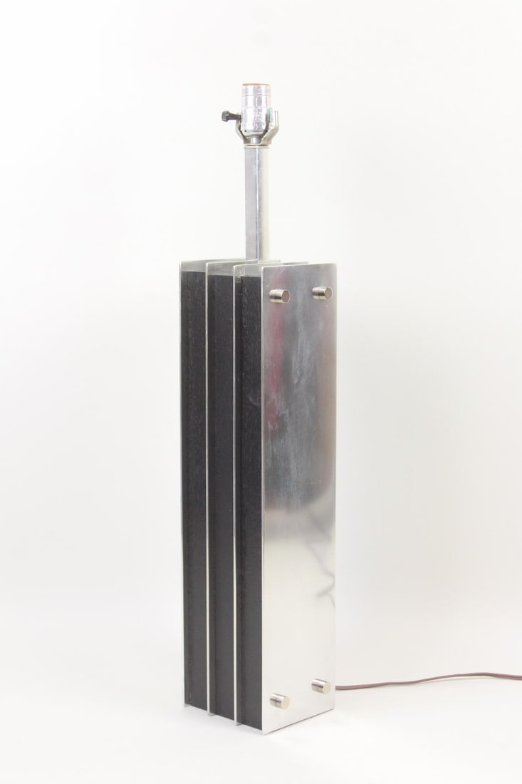 Industrial Modern Laurel Lamp; Steel & Ebonized Wood: Laurel Mid-Century Modern Steel Column Lamp. Made of steel and ebonized wood, lamp imitates an architectural steel column. Laurel design with no labels. Dimensions are 27.75 in h x 5.75 in w x 4.75 in