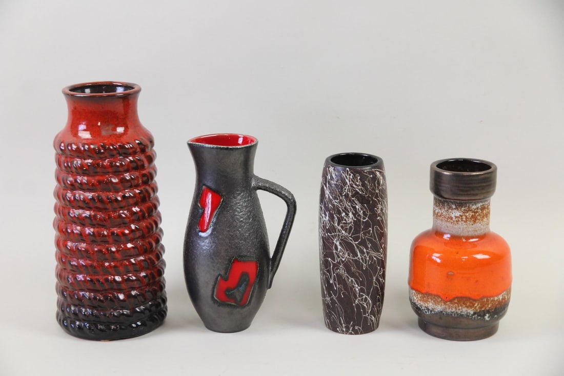Lot of 4 West German & Japan Pottery Vases, Fat Lava: Lot of 4 Mid-Century Modern West German & Japan Pottery Vases, Fat Lava. Includes 2 vases and a pitcher in red, orange and black Fat Lava glazes from West Germany , as well as a black vase with white 