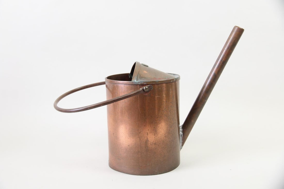 Handmade Copper Watering Can: Handmade Copper Garden Watering Can. A handmade copper watering can with large handle. Etched signature to the bottom, "Michael Salvatore, 2014". Dimensions are 18.25 in h x 10 in w x 15 in d. Conditi