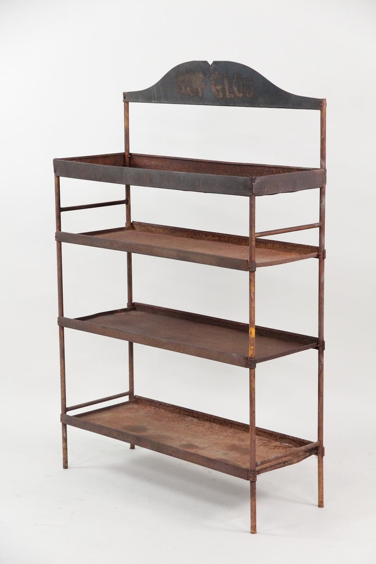 Sof Glos Paint Advertising Display, Shelf: Industrial Metal "Sof Glos" Paint Display Rack. A four-tiered industrial display rack made of patinated, rusted metal. It features an arched advertising header at the top that reads "Sof Glos." Dimens