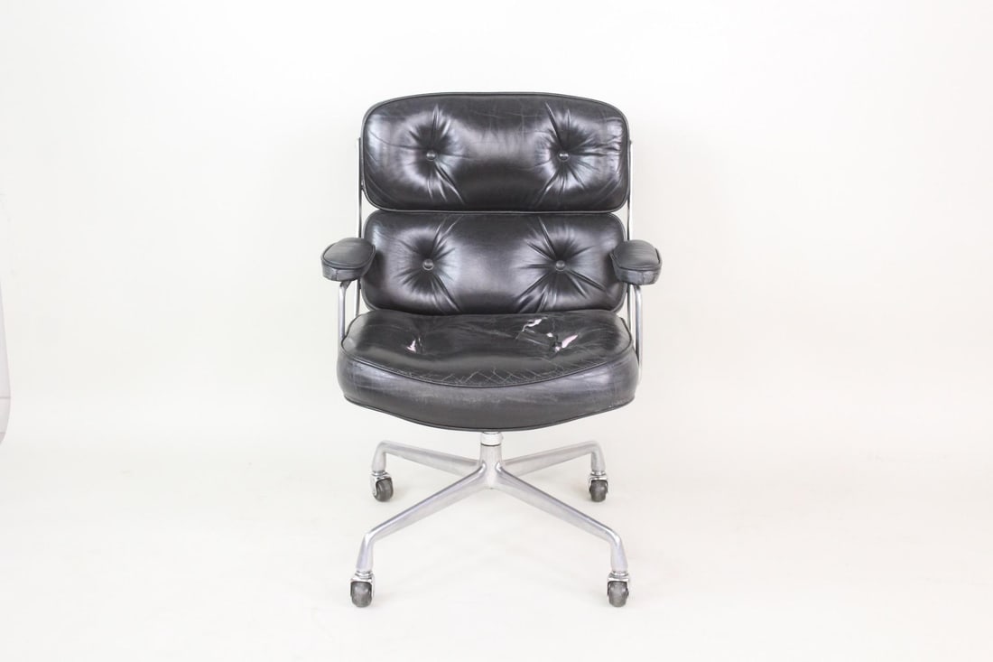 Mid-Century Modern Leather Eames 'Time Life' Executive Chair, Herman Miller: Mid-Century Modern Leather Eames 'Time Life' Executive Chair, Herman Miller. This rolling armchair on 4 wheels has a tufted buttoned back and padded arms, with industrial metal side braces. Marked as 