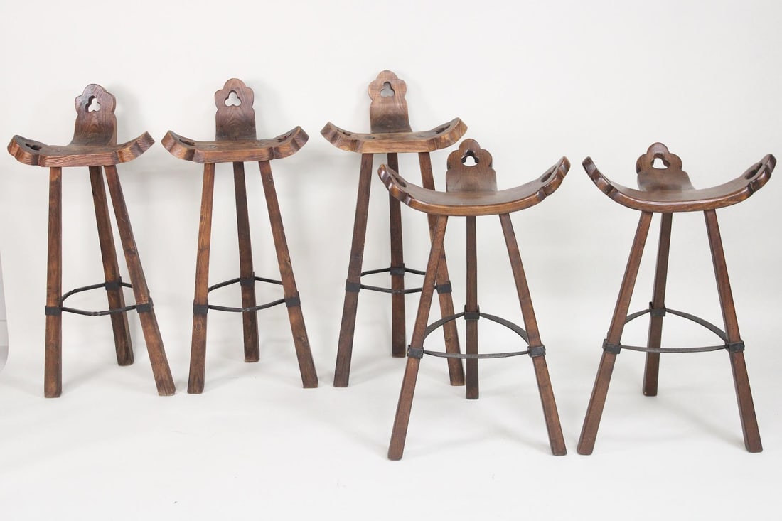 Lot of 5 Spanish Wood & Iron Bar Stools, Sergio Rodrigues 'Marbella' Style: Lot of 5 Spanish Wood & Iron Bar Stools, Sergio Rodrigues 'Marbella' Style. This lot includes two slightly different styles of this Brutalist stool with winged curved bentwood seats with 3 gothic cut 