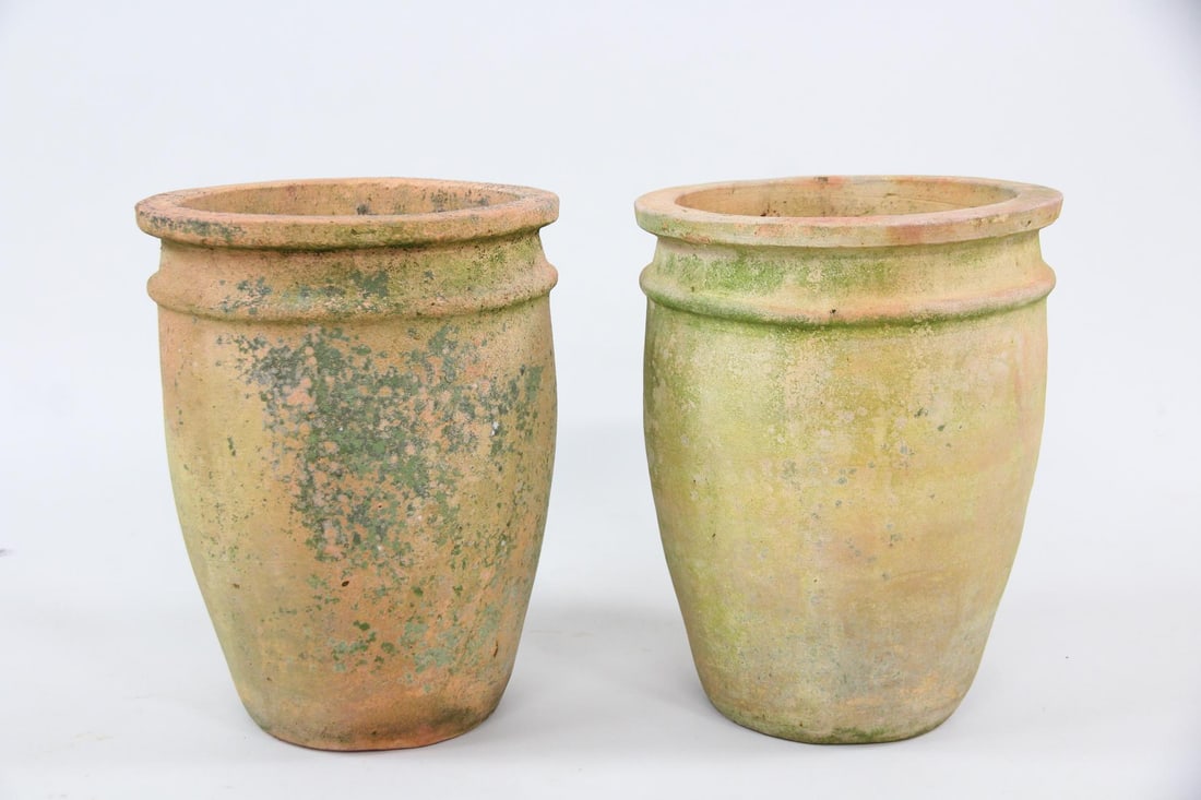 Pair of Mossy & Weathered Terra Cotta Plant Pots: Pair of Mossy & Weathered Terracotta Plant Pots, Planters. Matching pair of cylindrical plant pots with double lip and weathered finish. Dimensions are 12 in h x 9.5 in w x 9.5 in d. Condition is good