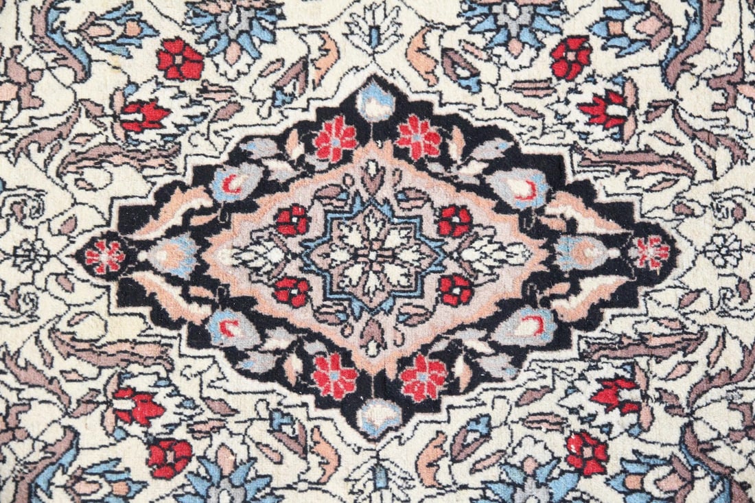 Persian Style Wool Rug, Black, Red, & Blue Florals: Persian Style Wool Rug, Black, Red, & Blue Florals. This rug features a traditional medallion with small-scale floral motifs in black, red, and blue. Made of wool on a cotton foundation with fringed e