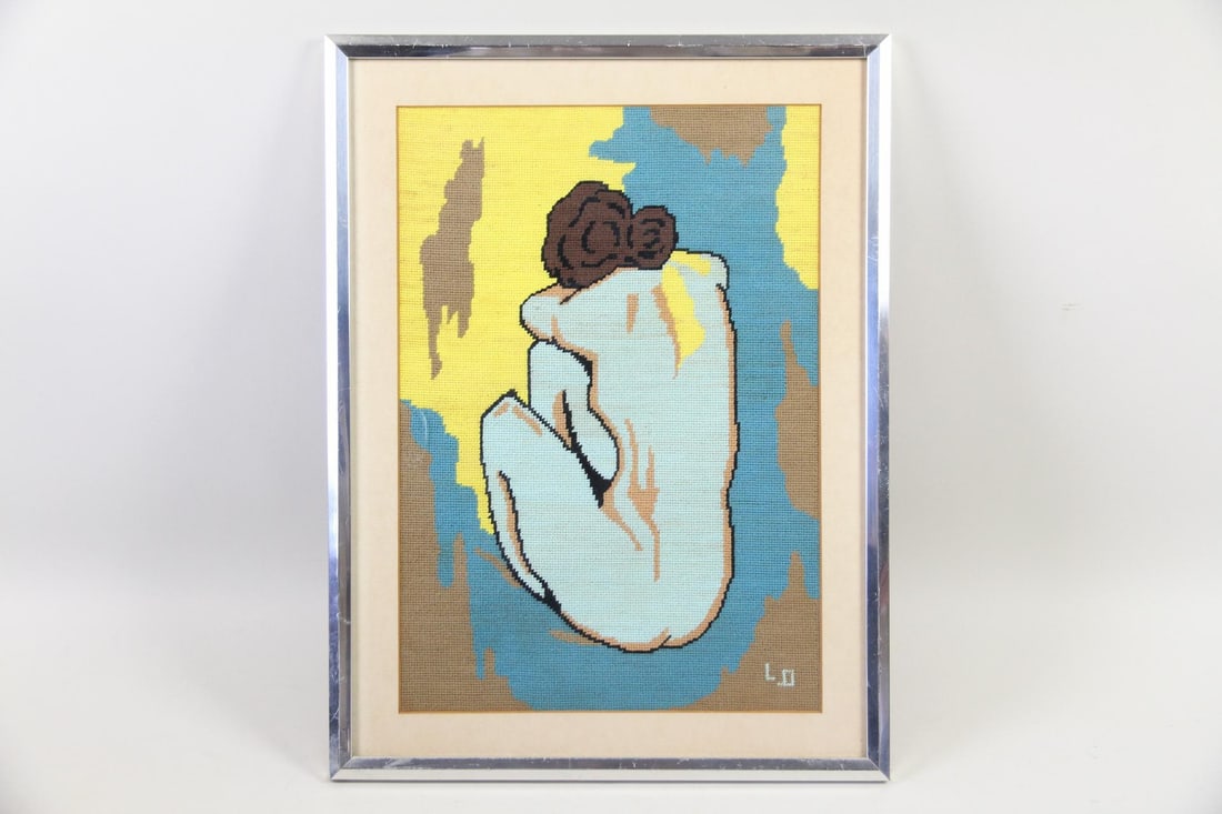Needlepoint Picture after Picasso's Blue Nude: Needlepoint Picture after Picasso's Blue Nude. Needlepoint wall hanging inspired by Picasso's Blue Nude, in a silver tone metal frame. Dimensions are 21 in h x 16 in w x .75 in d. Condition is good wi