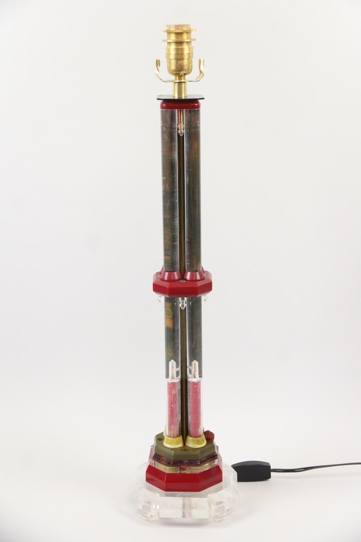 Colorful Lucite Column Lamp: Colorful Lucite Column Lamp. Unusual lamp with a stacked green, clear and red acrylic base with a 4 column stem. Dimensions are 27.5 in h x 6 in w x 6 in d. Condition is good with some cracks and chip